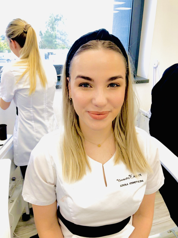 Cosmetology student developing practical skills during professional beauty training.