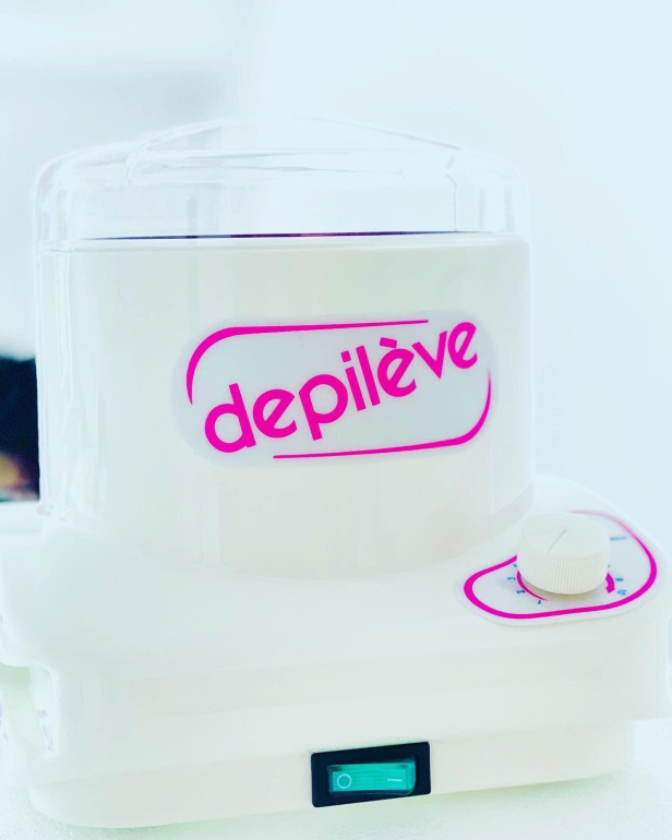 Waxing training using Depilève products and professional hair removal techniques.
