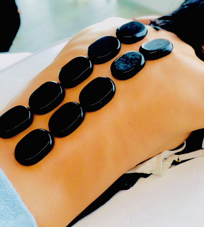 Hot stone massage training covering relaxation techniques, spa therapy, and basalt stone massage.