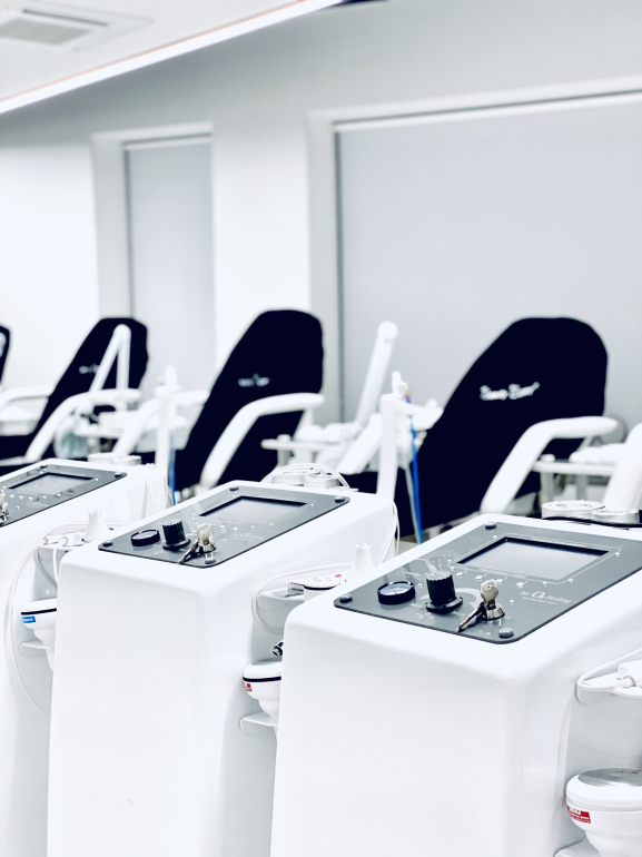 Modern cosmetology training stations equipped for aesthetic treatment education and hands-on practice.