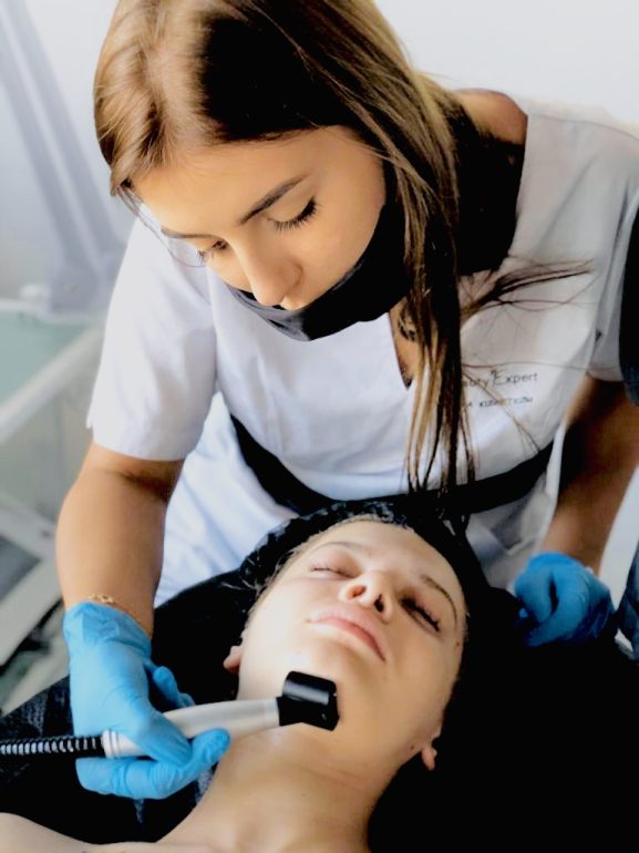 Preparing a professional treatment station and skincare products before aesthetic procedures.