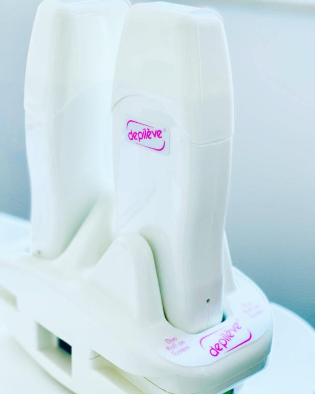 Professional wax warmer used during waxing training and hair removal procedures.