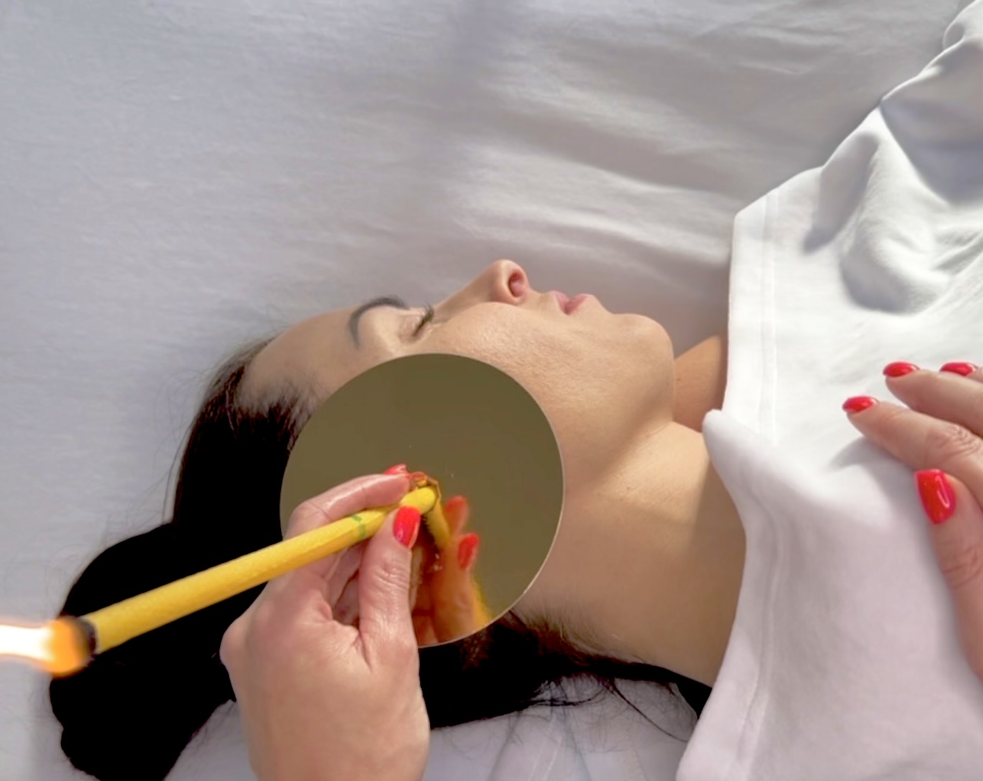 Ear candling – selection of ear candles and treatment preparation during a lesson in the one-year beauty school program.